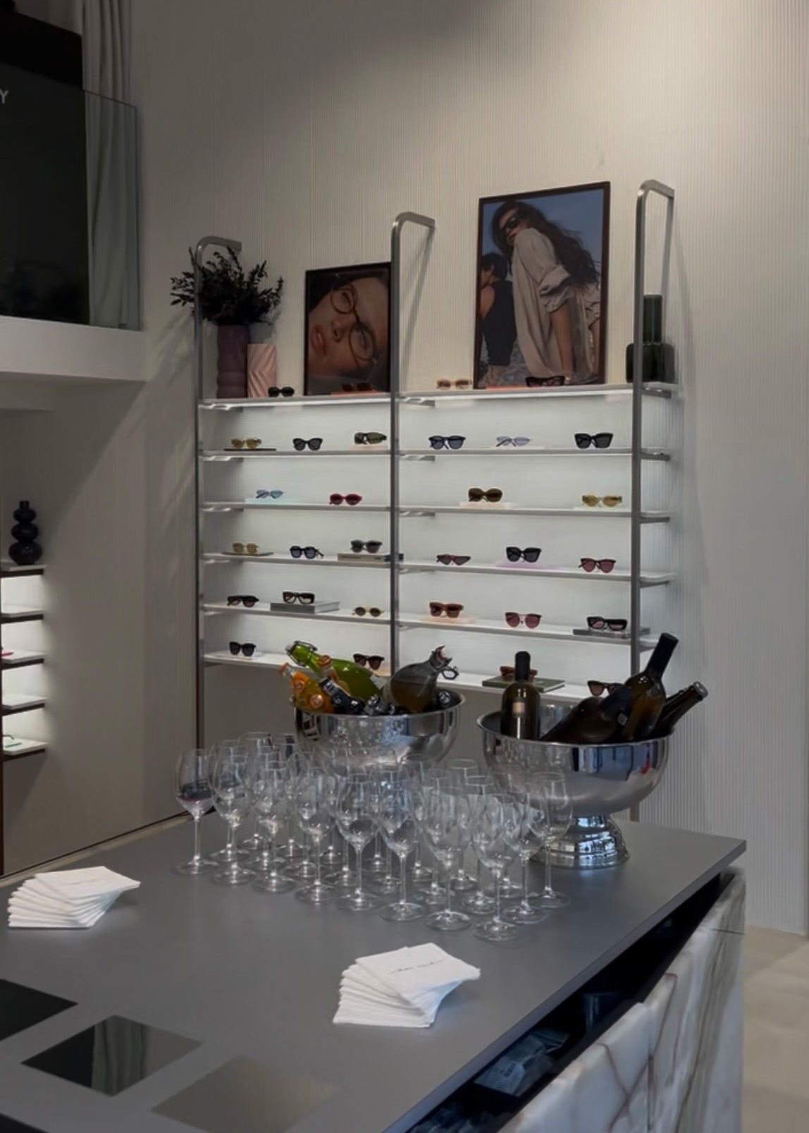 Eyewear showroom press day with display shelves and welcome drinks
